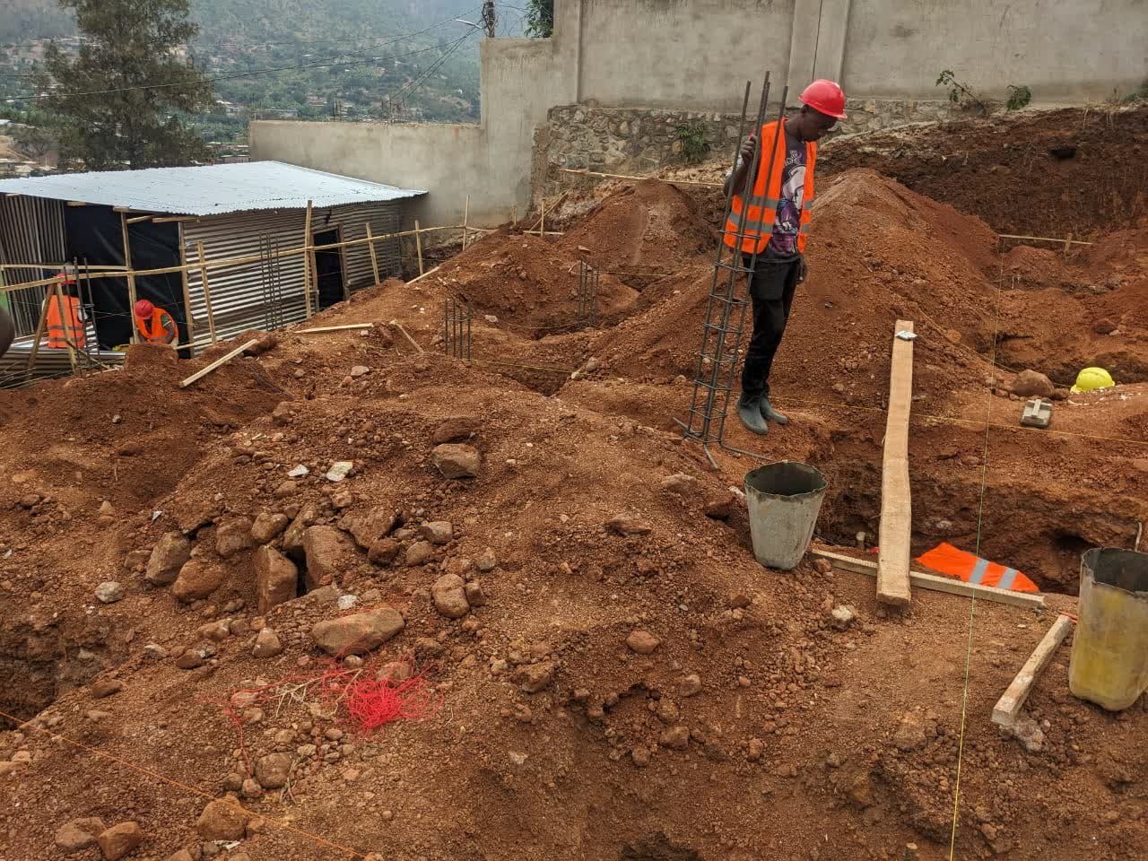 HDCG crew on an active foundation excavation site overlooking Kigali
