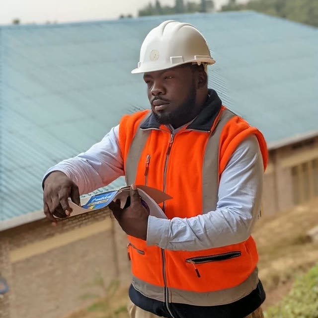 Naftar, Site Engineer, on site in a hard hat and safety vest